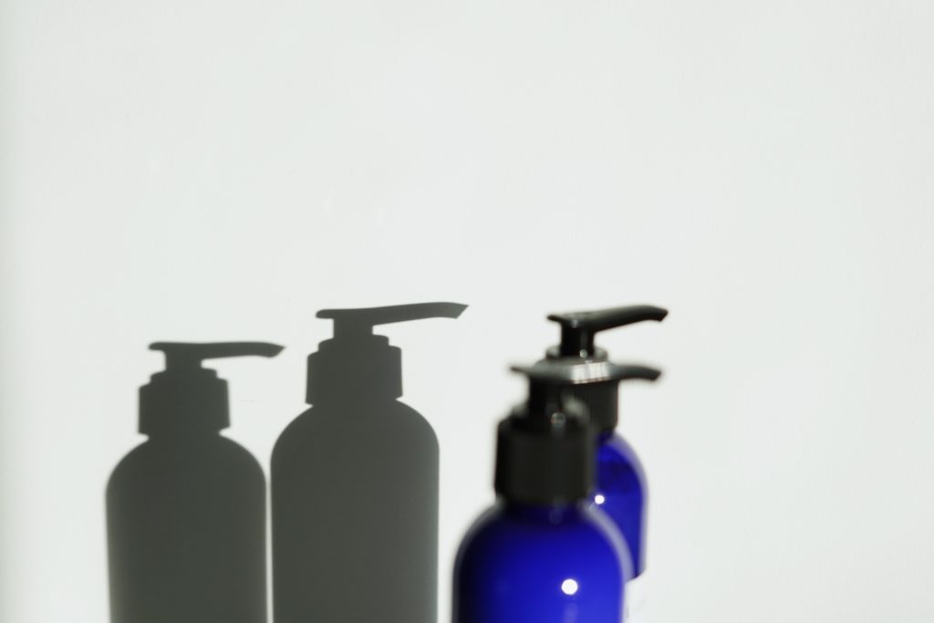 Blue glass beauty product bottles