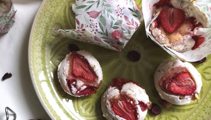 strawberry rhubarb muffins on a green plate