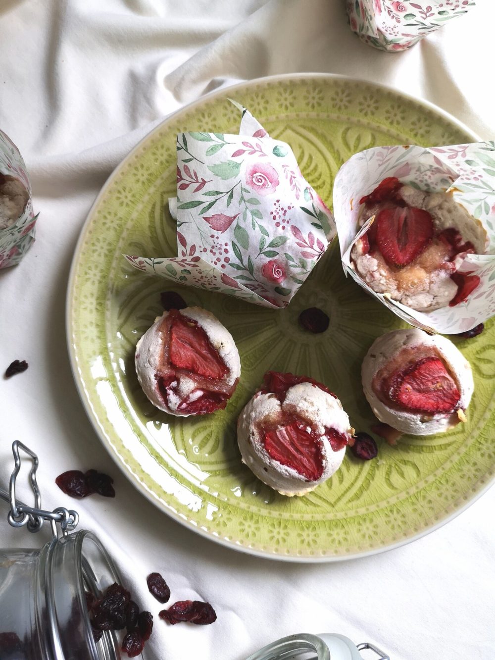 strawberry rhubarb muffins on a green plate