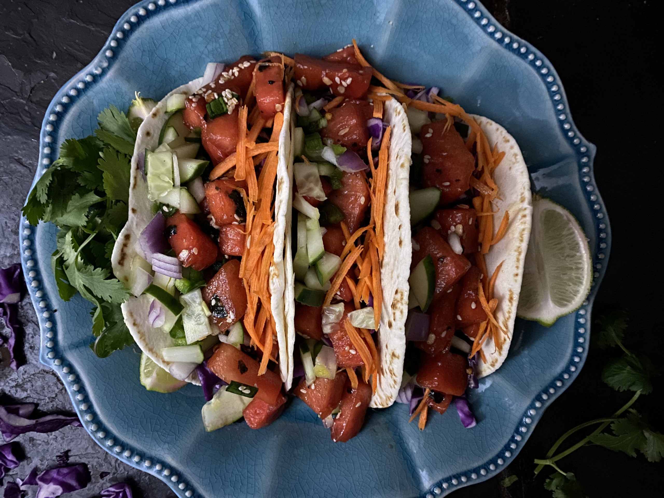 vegan tuna tacos on a blue plate