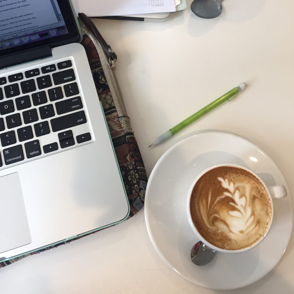 computer with coffee and pencil