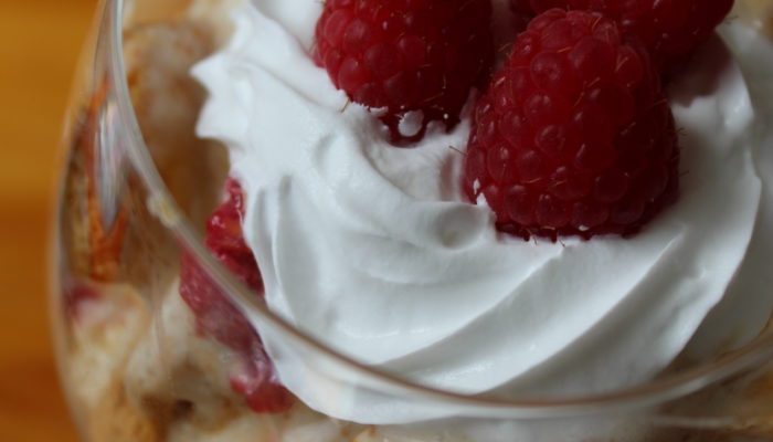 vegan dessert with honeycomb and raspberries in a glass