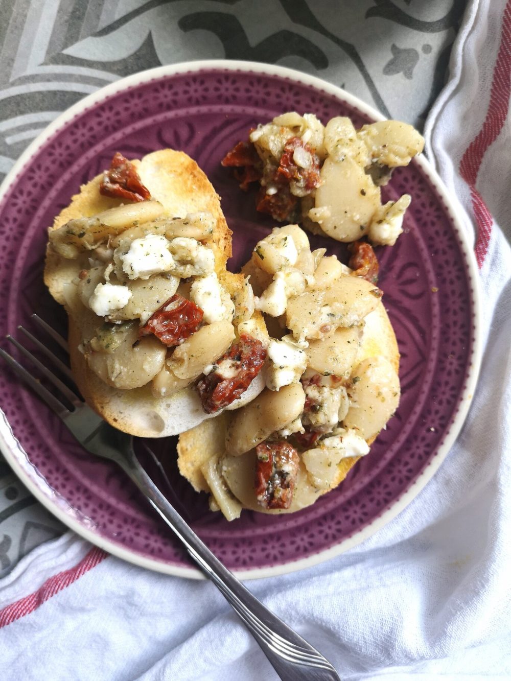 gigantes antipasto on a plate with a fork