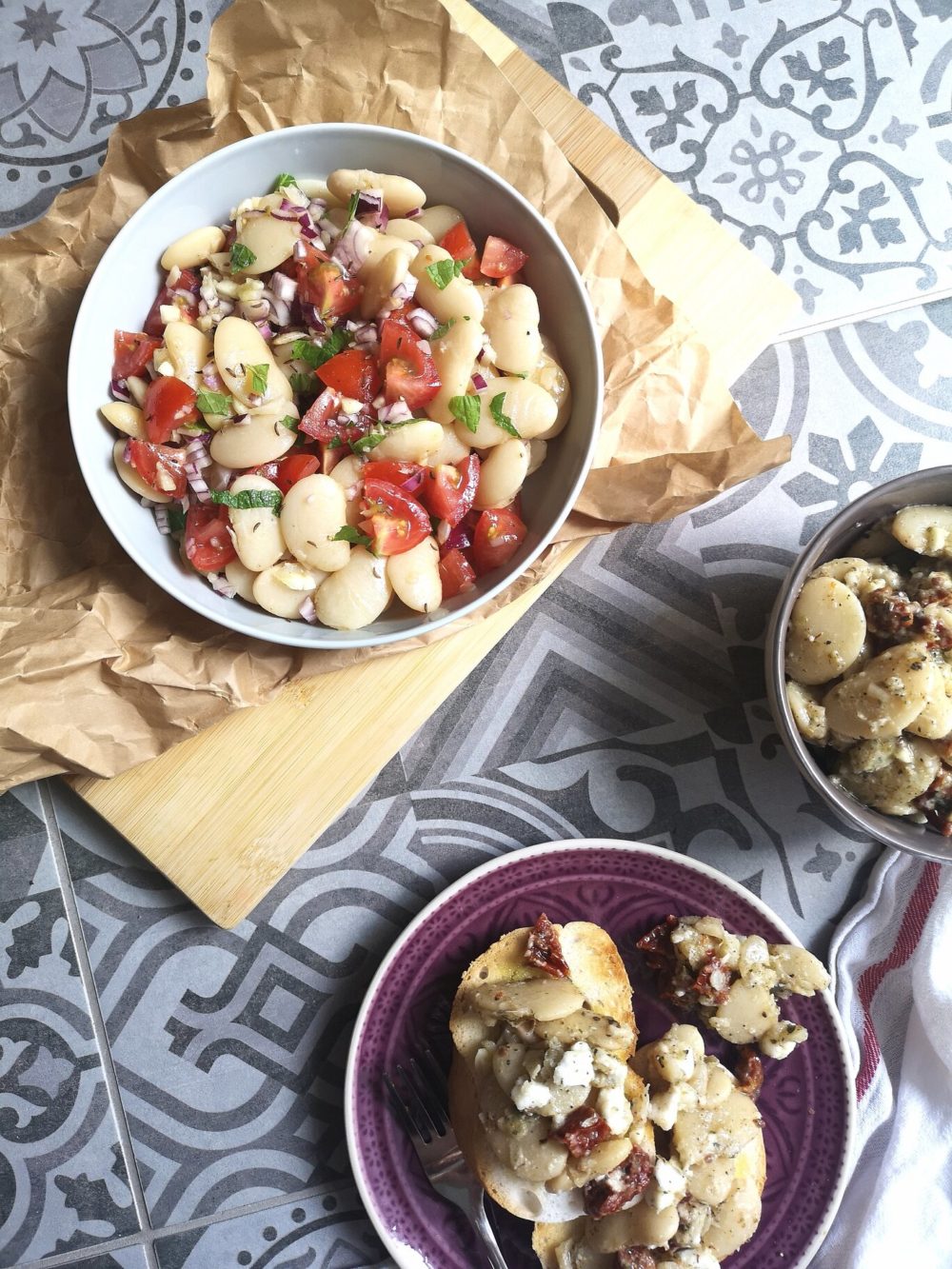 gigantes antipasto in bowls against a patterned background