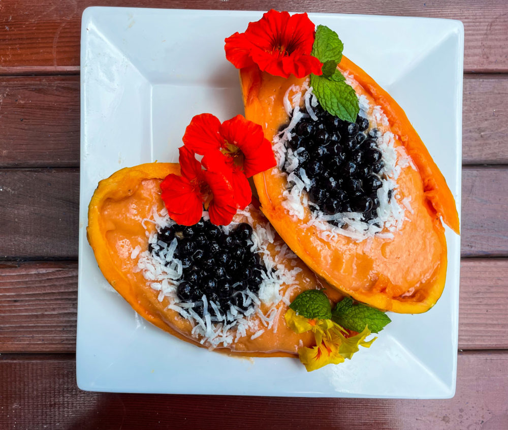 papaya boba smoothie bowl on white plate