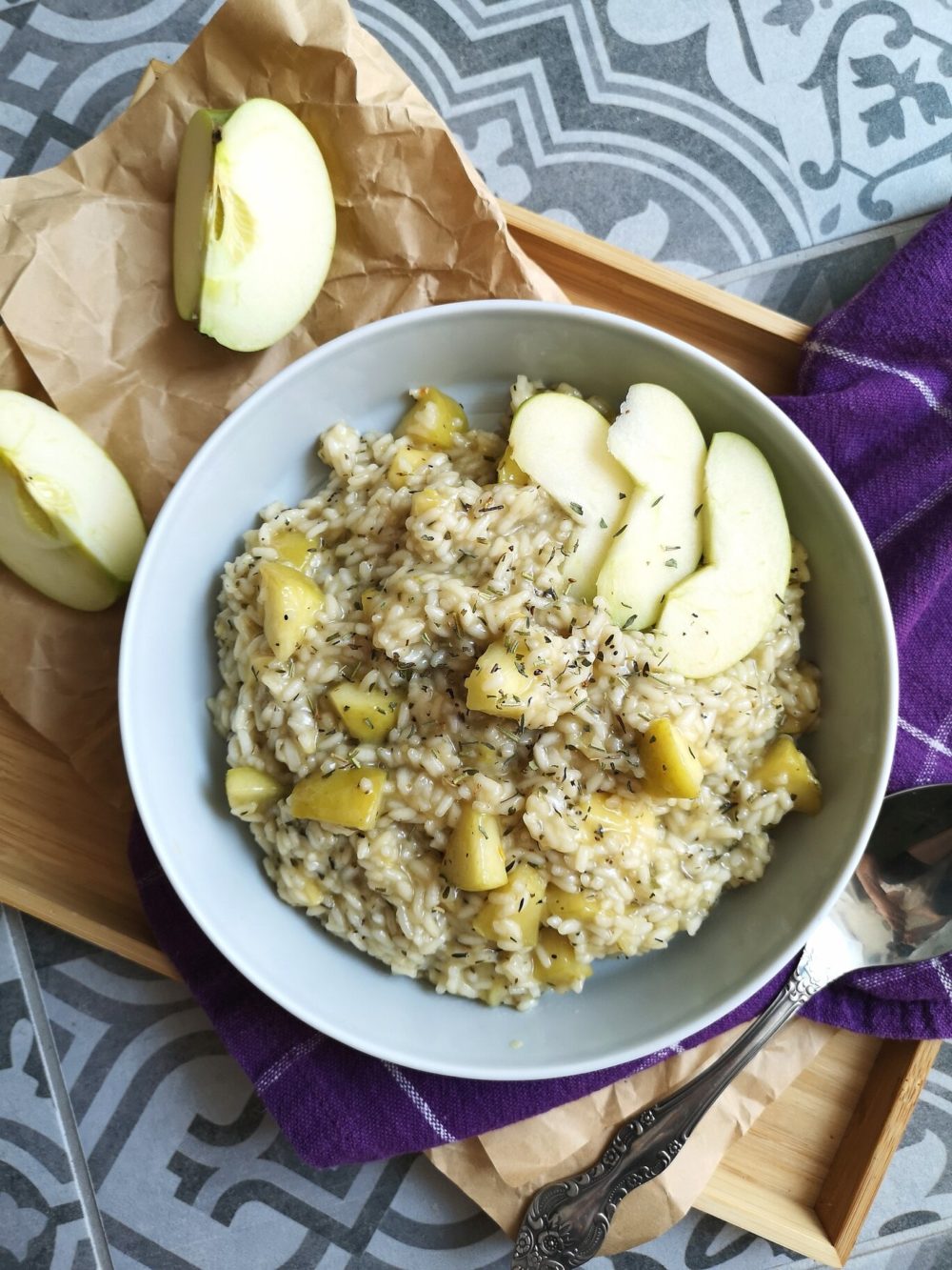 a bowl of apple risotto with smoky vegan cheese