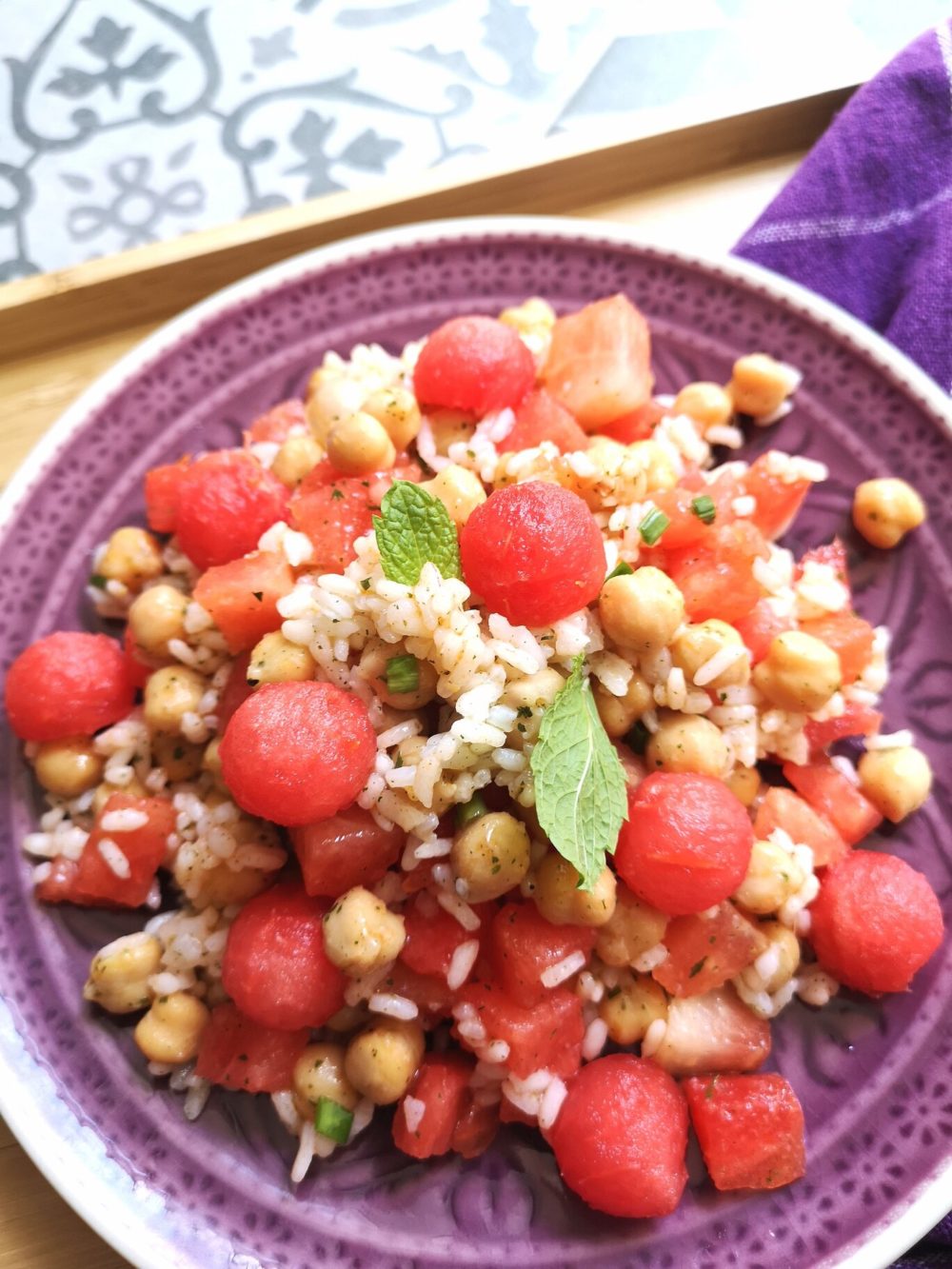 watermelon rice salad on a purple plate