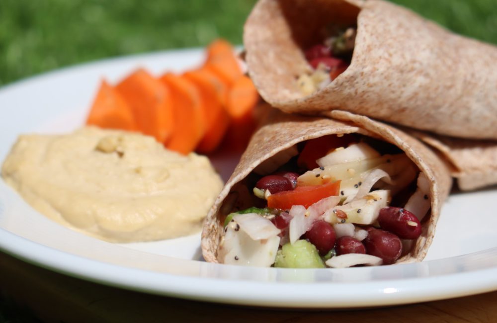 vegan fajita wraps on a white plate