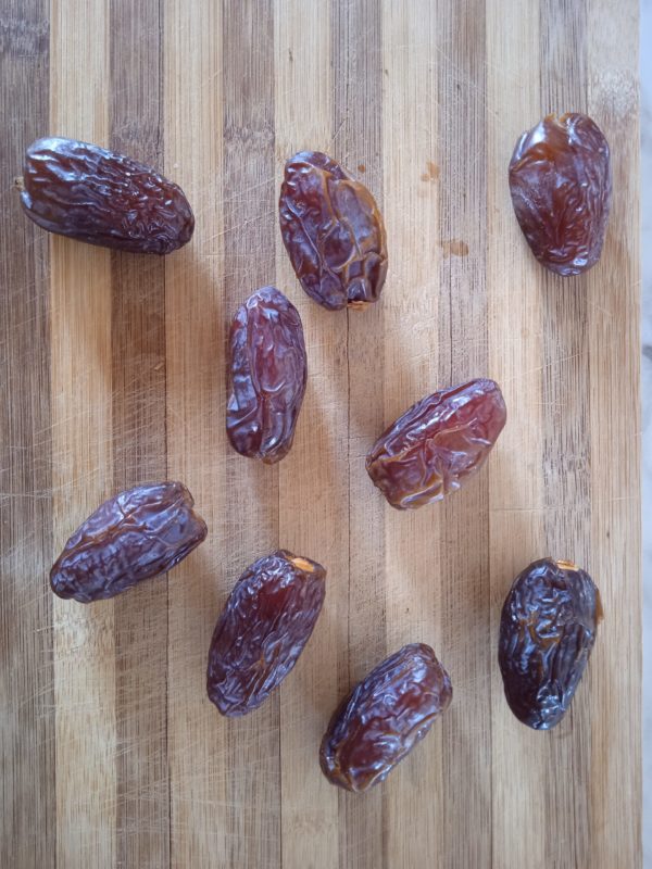 medijool dates against a wooden background