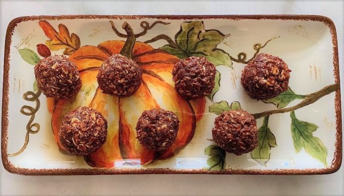 pumpkin pie energy balls against a decorative fall plate