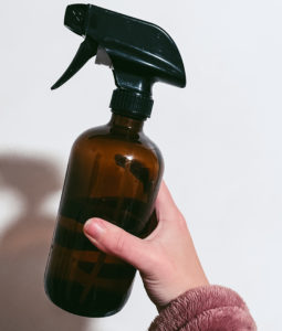hand holding a spray bottle