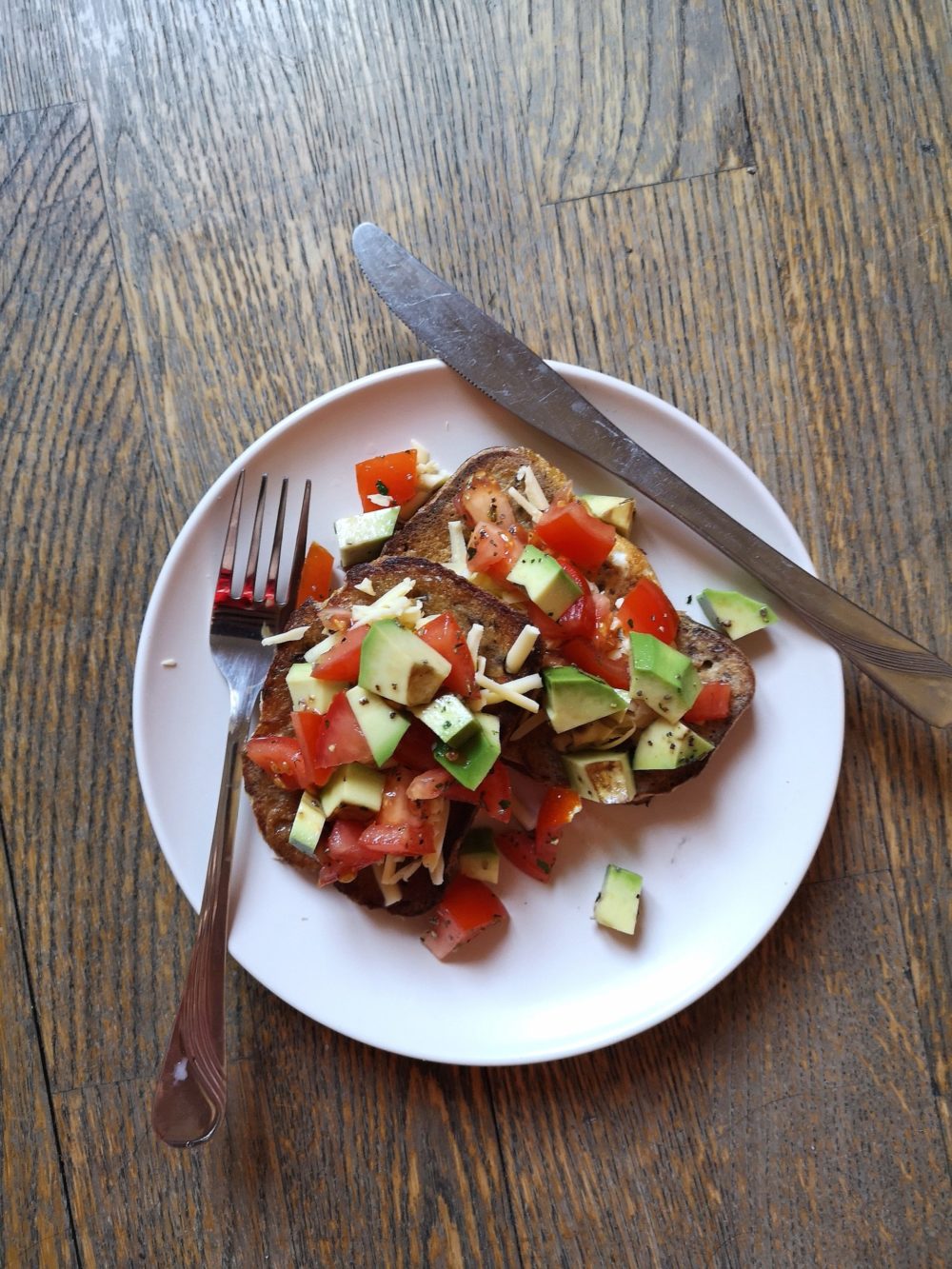 vegan mexican style "eggy" bread on a white plate with silverware