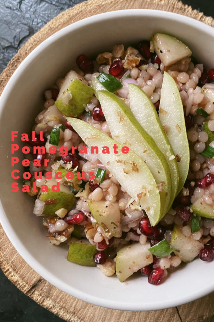 pomegranate pear couscous salad with red caption