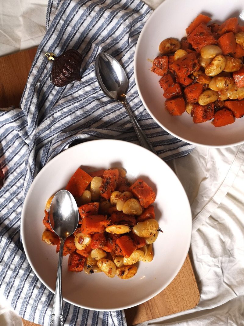 oven baked stew on white plates with spoons