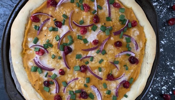 vegan butternut pizza with a dark background