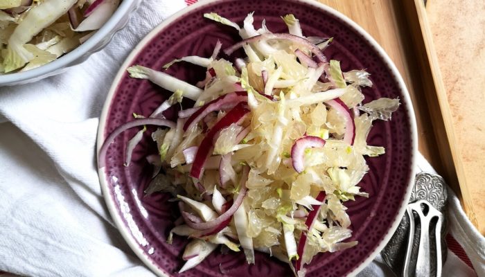 pomelo salad on a wooden surface