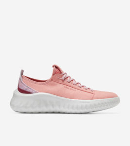 a pink sneaker with a white background