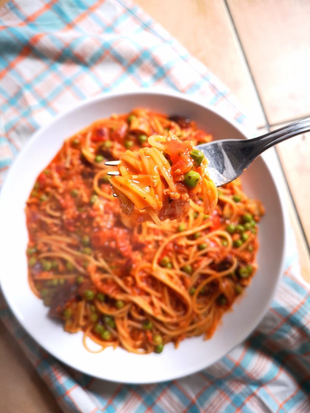 one-pot vegan pasta dish on a white plate with fork