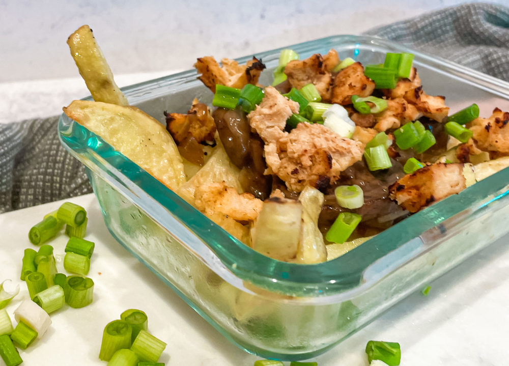 vegan poutine fries in a glass dish