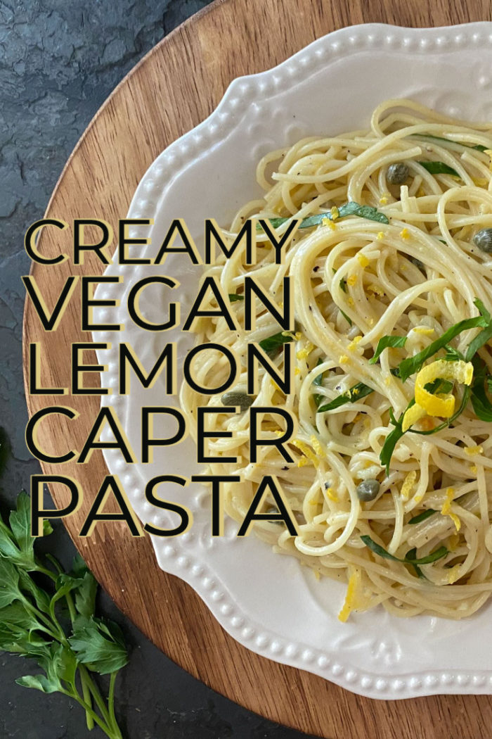lemon caper pasta in a white dish with caption
