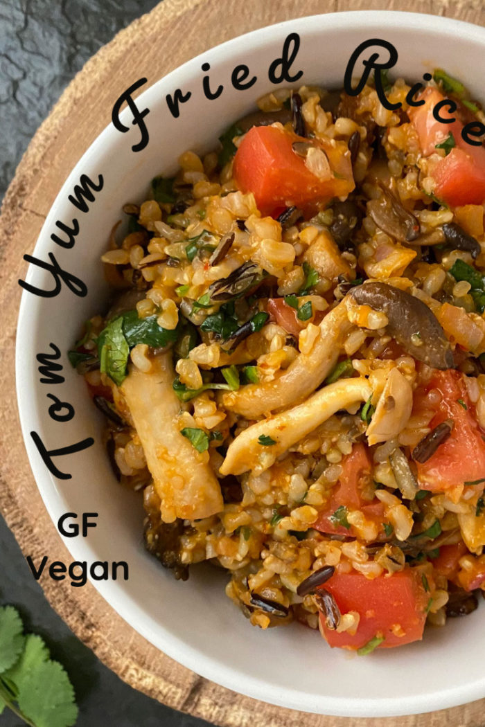 vegan tom yum fried rice in a white dish with caption