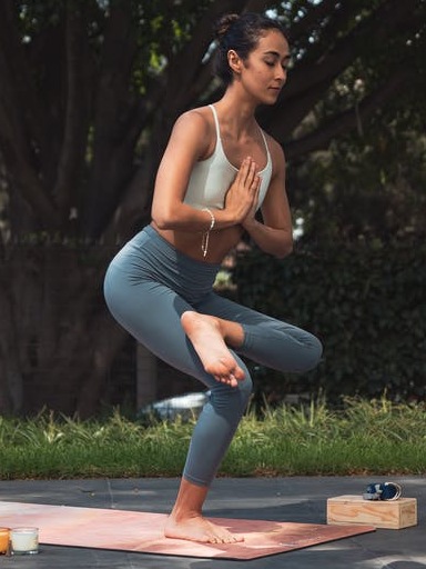 woman doing yoga outside