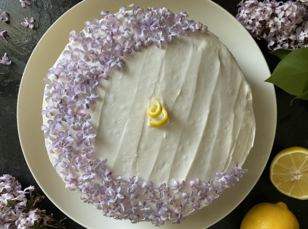 vegan lilac lemon cake on a white plate