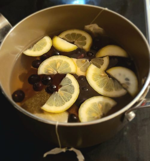 lemon blueberry tea in a pot on the stove