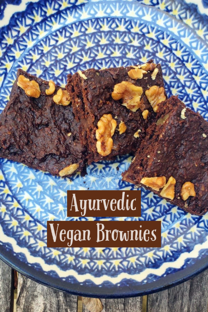 ayurvedic vegan brownies on a blue patterned plate with caption