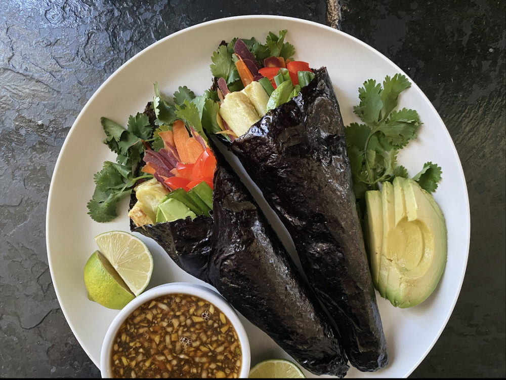 sweet potato nori rolls on a white plate