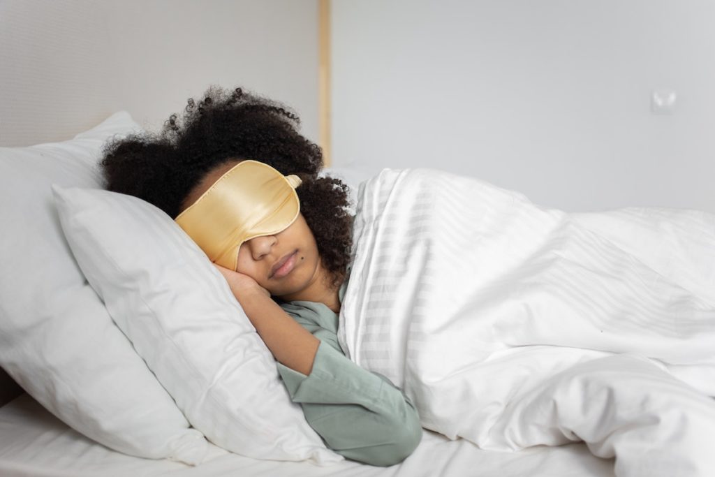 woman sleeping with sleep mask 