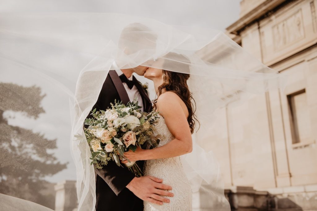 bride and groom kissing on wedding day