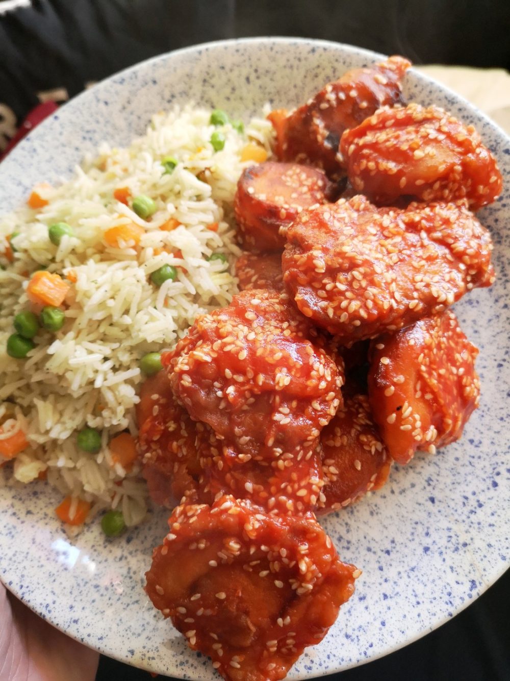 vegan sesame chick-un on a white and blue speckled plate