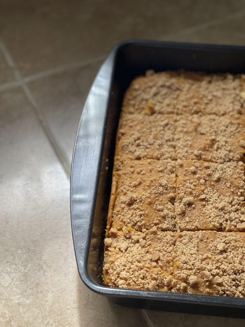 pumpkin tray cake on a tiled background