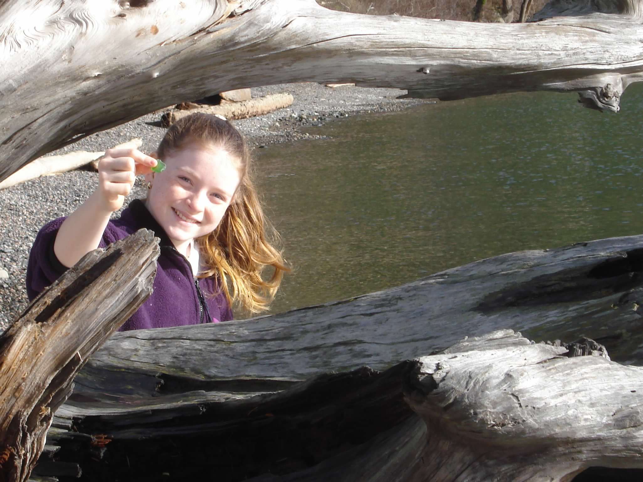 Girl holding up seaglass