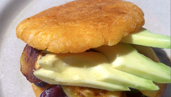 vegan arepas on a white plate