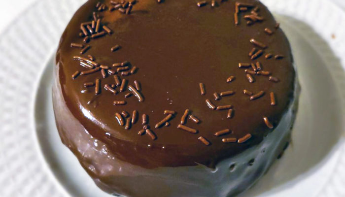 chocolate biscuit cake on a white plate