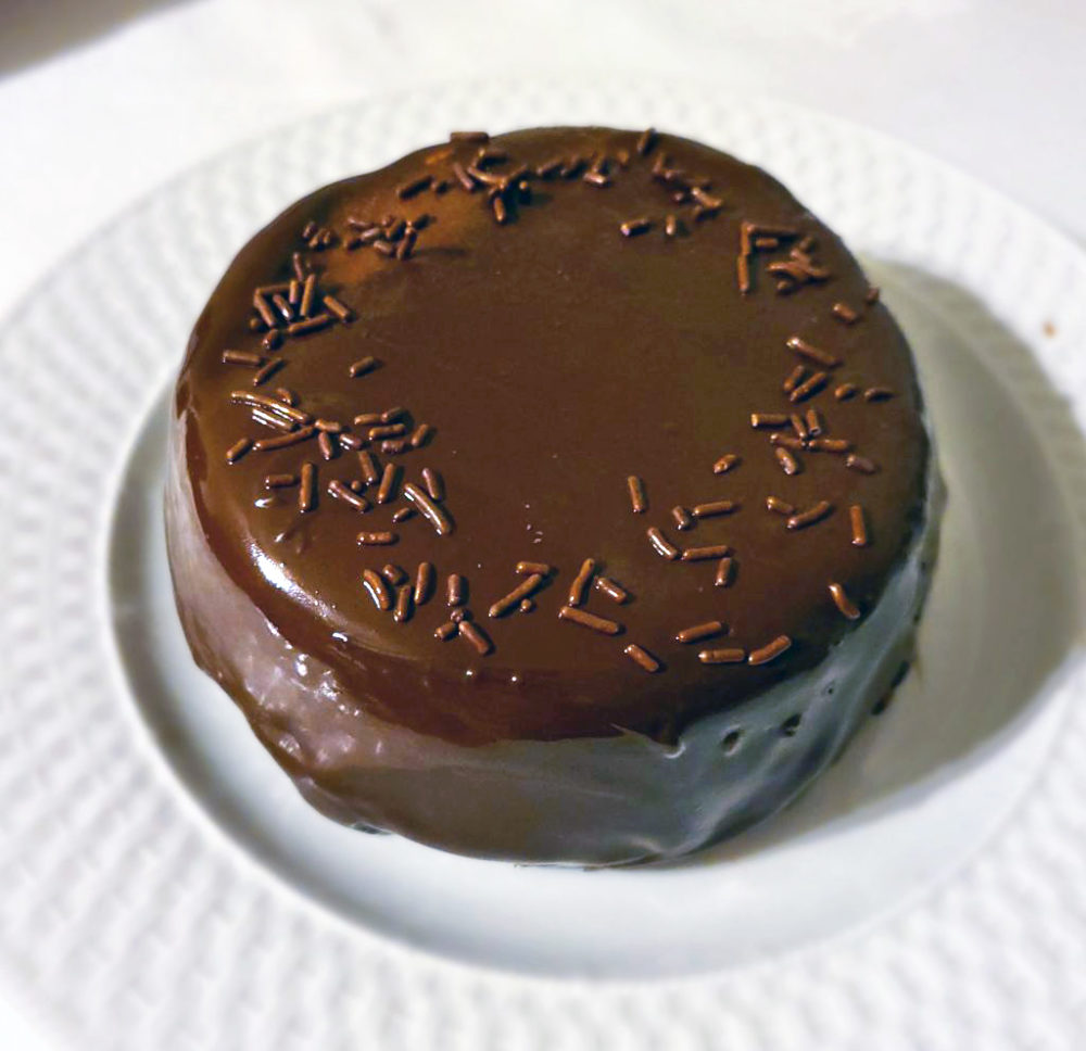 chocolate biscuit cake on a white plate