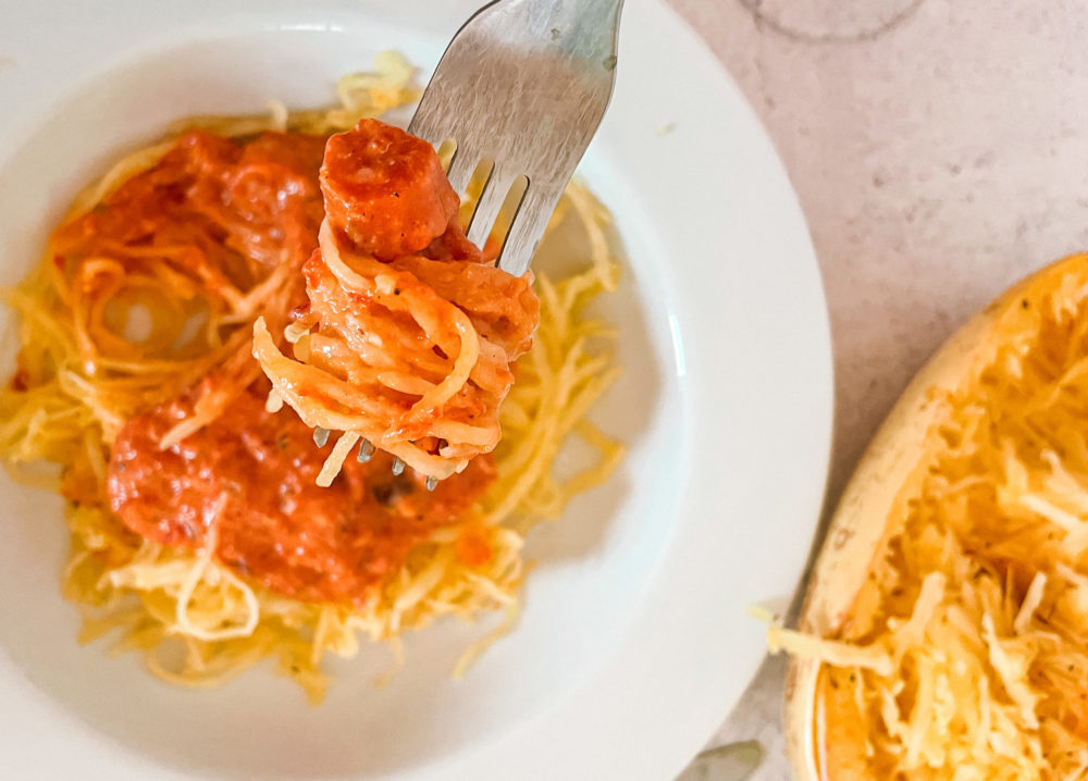 roasted red pepper squash noodles on a white plate
