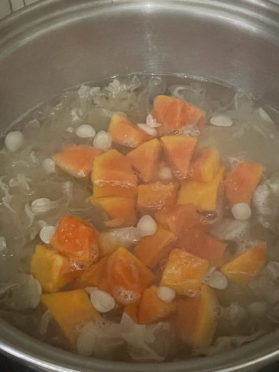 soup ingredients cooking in a silver pot