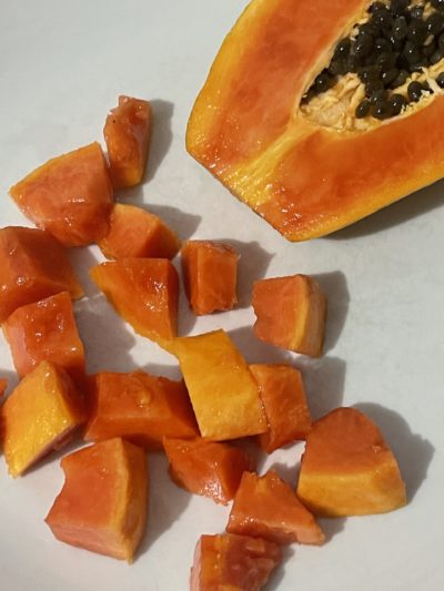 papaya against a white background