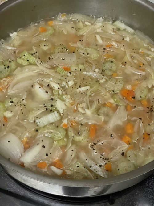 vegan chicken macaroni soup in a silver bowl