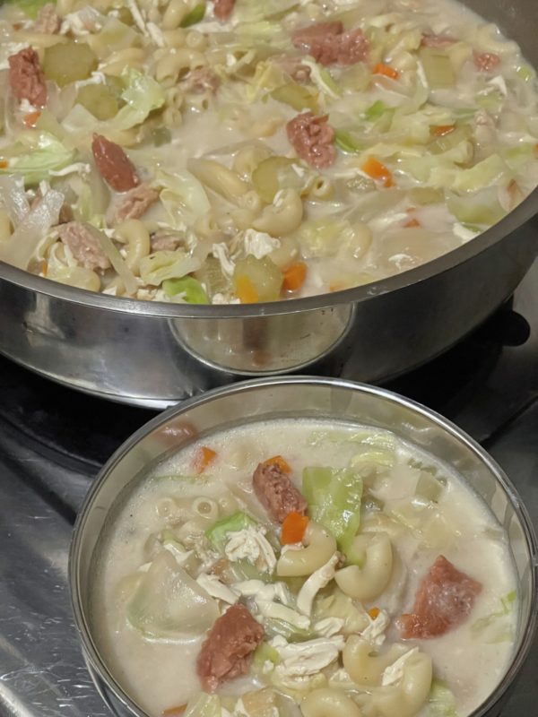 vegan chicken macaroni soup in two silver bowls