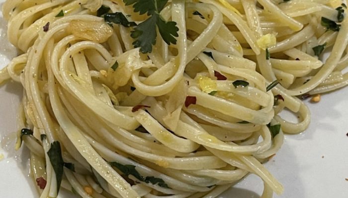 A serving of pasta on a white plate