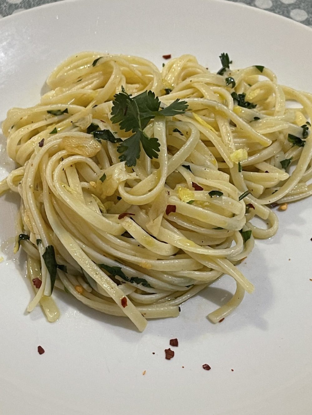 A serving of pasta on a white plate