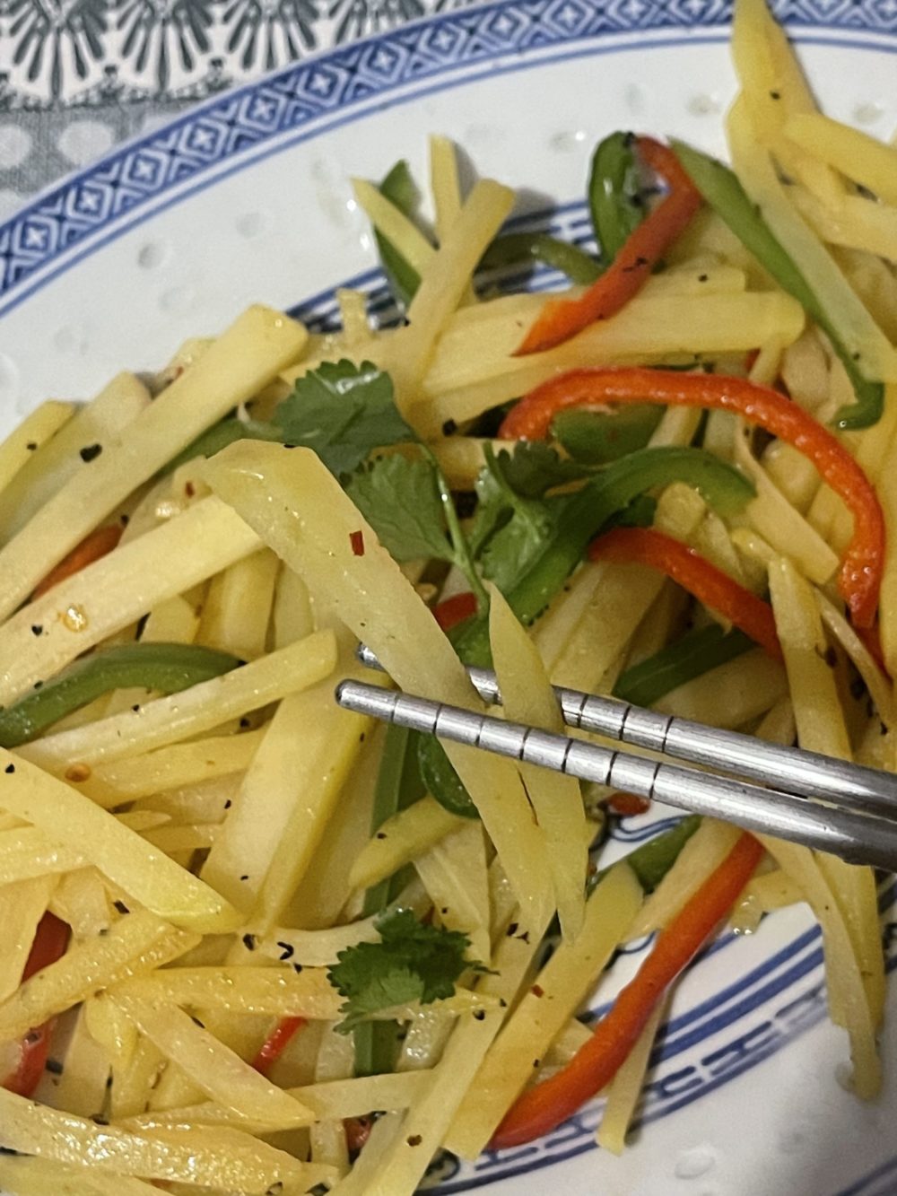 cooked potatoes and bell peppers on a plate