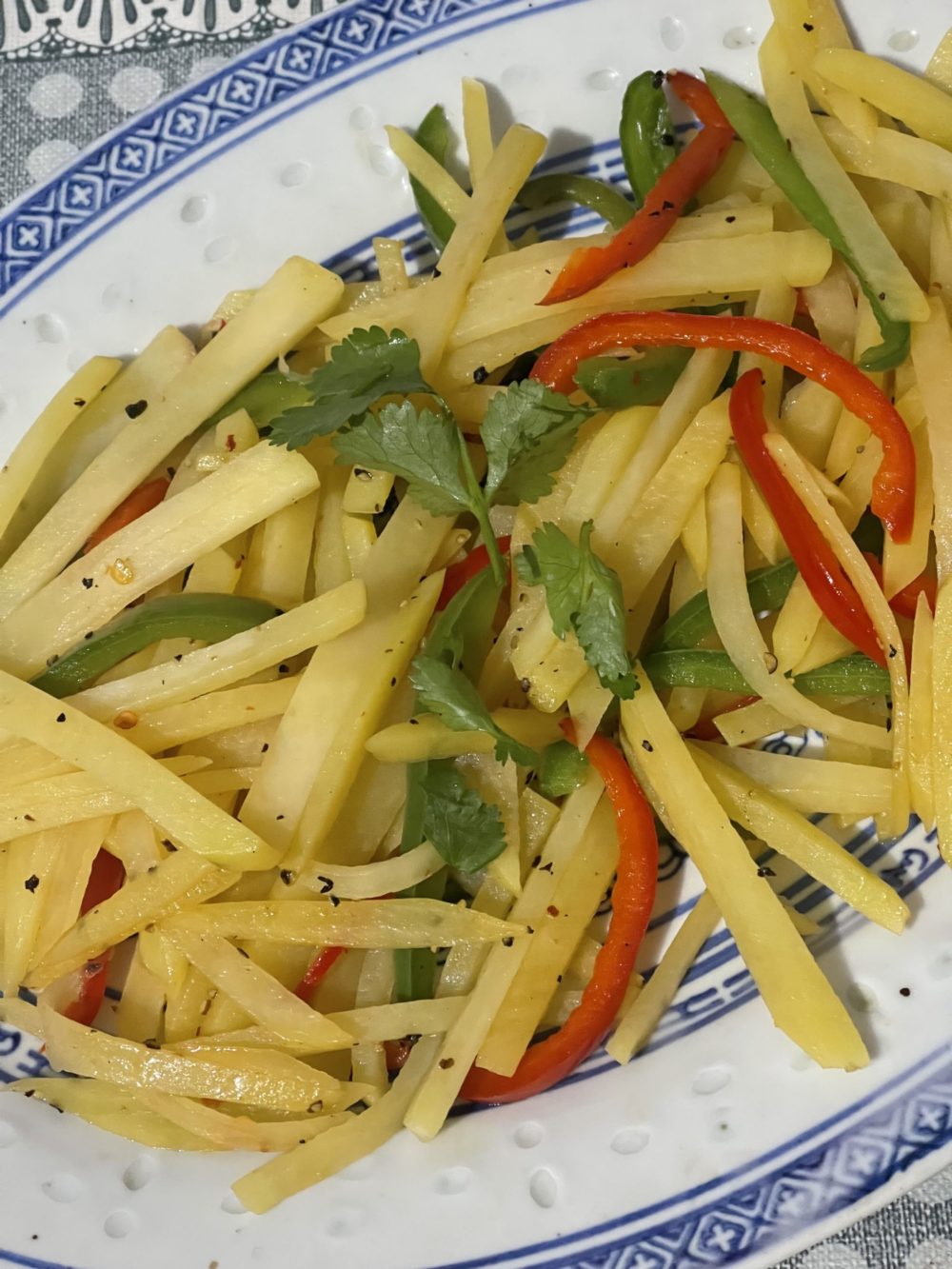 shredded potatoes and bell peppers on a plate