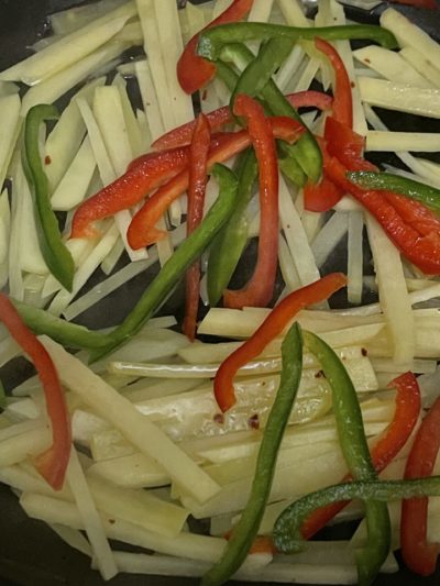 shredded potatoes with red and green bell peppers