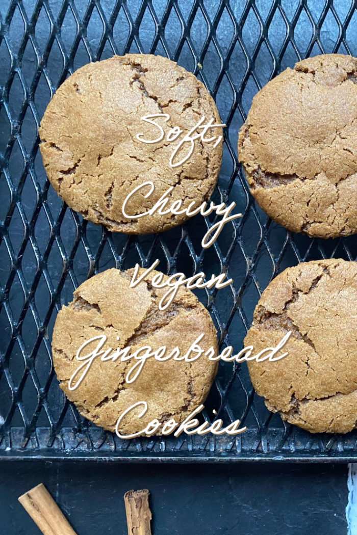 vegan gingerbread cookies on a black cooling rack with a caption