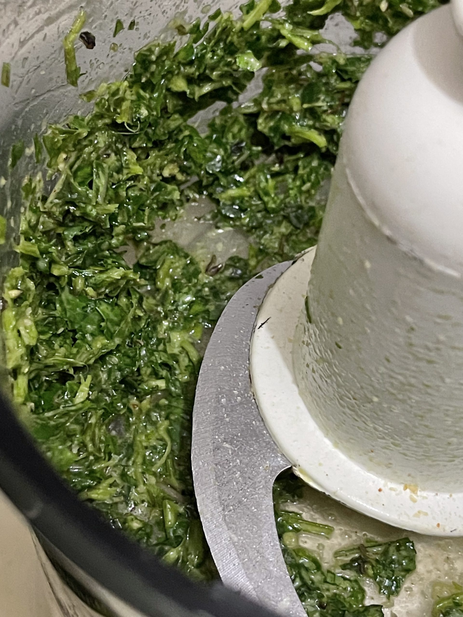 Spinach and seasonings in a food processor